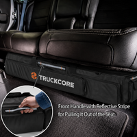 Thumbnail for Black storage bag with 'TRUCKCORE' branding inside a vehicle, showing a front handle with a reflective stripe.